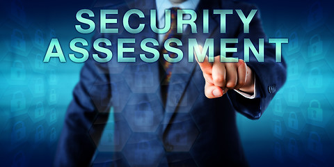 Image showing Consultant Touching SECURITY ASSESSMENT Onscreen