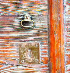 Image showing  varese abstract  rusty brass brown knocker in a    