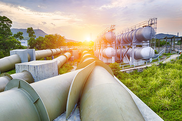 Image showing Oil and gas industry refinery factory at sunset