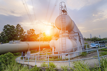 Image showing Oil and gas industry refinery factory at sunset