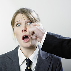 Image showing Female executive punched