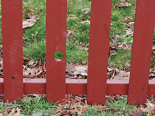 Image showing Red Picket Fence Knothole