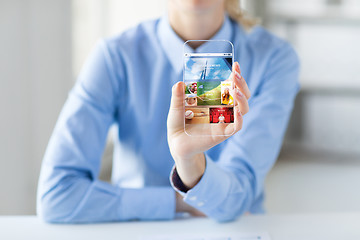 Image showing close up of woman with application on smartphone