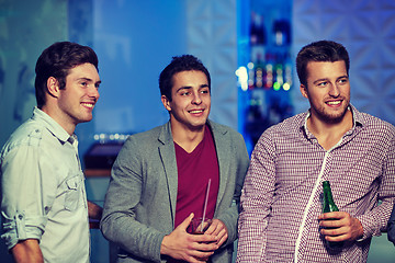 Image showing group of male friends with beer in nightclub