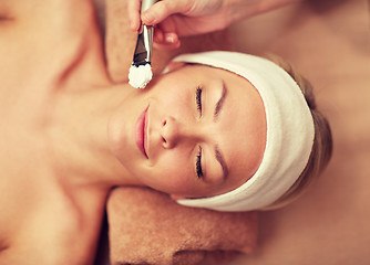 Image showing close up of young woman and cosmetologist in spa