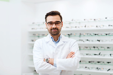 Image showing man optician in glasses and coat at optics store