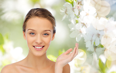 Image showing smiling young woman face and shoulders