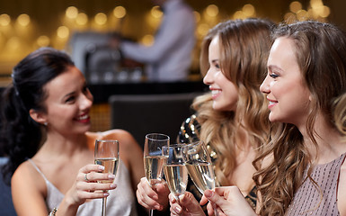 Image showing happy women with champagne glasses at night club