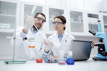 Image showing young scientists making test or research in lab