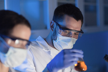 Image showing close up of scientists making test in lab