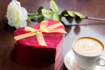 Image showing close up of gift box and coffee cup on table
