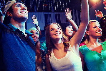 Image showing smiling friends at concert in club