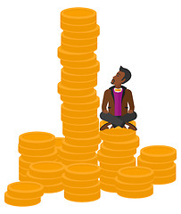 Image showing Businessman sitting on gold.