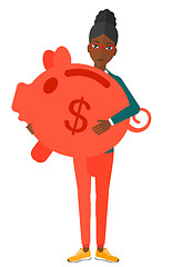 Image showing Woman carrying piggy bank.