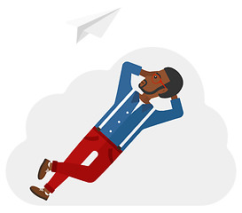 Image showing Businessman relaxing on cloud.