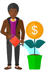 Image showing Man watering money flower.