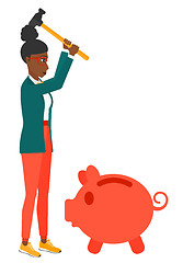 Image showing Woman breaking piggy bank.