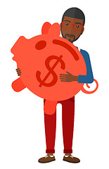 Image showing Man carrying piggy bank.