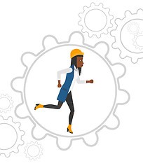 Image showing Woman running inside the gear.