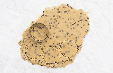 Image showing Circles being cut from rolled out cookie dough 