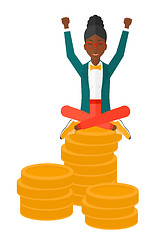 Image showing Happy business woman sitting on coins.