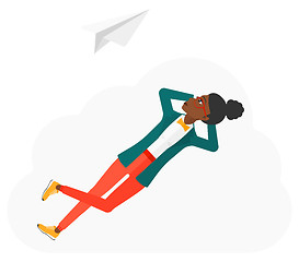 Image showing Business woman relaxing on cloud.