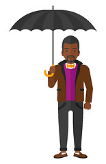 Image showing Businessman standing with umbrella.