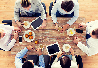 Image showing close up of business team drinking coffee on lunch