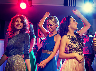 Image showing smiling friends dancing in club