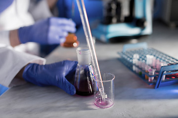 Image showing close up of scientists making test in lab