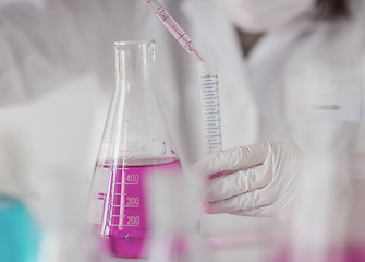 Image showing close up of scientist making test in lab