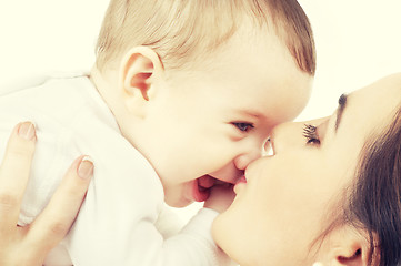 Image showing mother kissing her baby