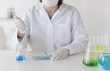 Image showing close up of scientist making test in lab