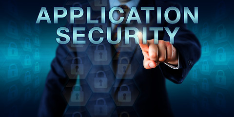 Image showing Executive Pushing APPLICATION SECURITY Onscreen