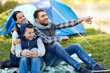 Image showing happy family with tent at camp site