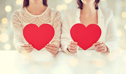 Image showing close up of happy lesbian couple with red hearts