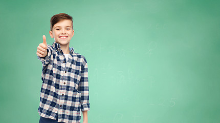 Image showing smiling boy in checkered shirt showing thumbs up