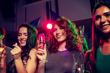 Image showing smiling friends with glasses of champagne in club