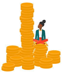 Image showing Business woman sitting on gold.