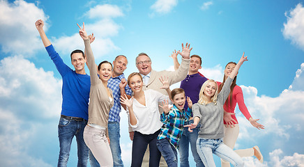 Image showing happy people having fun over sky and clouds