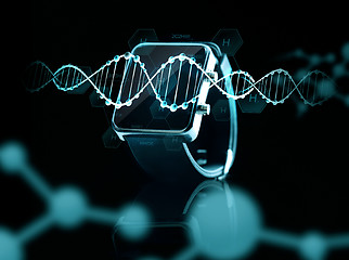 Image showing close up of black smart watch over dna molecules