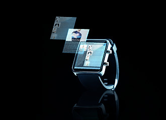 Image showing close up of black smart watch with web page