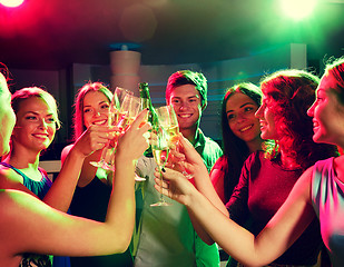 Image showing smiling friends with wine glasses and beer in club