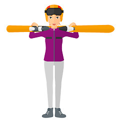 Image showing Woman holding skis.