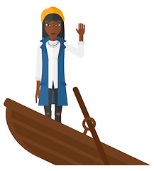 Image showing Business woman standing in sinking boat.