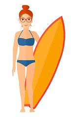 Image showing Surfer holding surfboard.