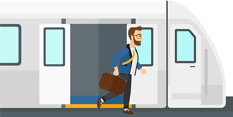 Image showing Man going out of train.