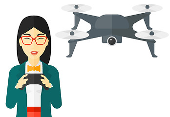 Image showing Woman flying drone.