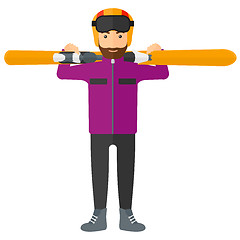 Image showing Man holding skis.