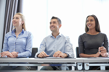 Image showing smiling business people meeting in office